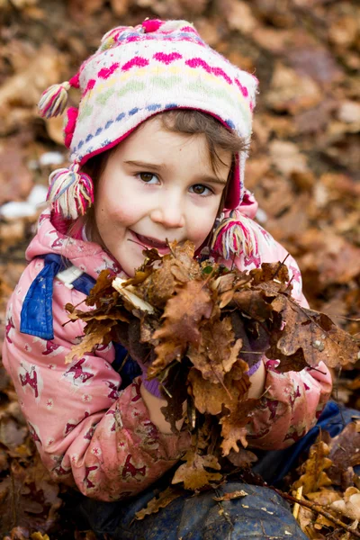 A closeup portrait of a little girl in autumn — Stock Photo, Image