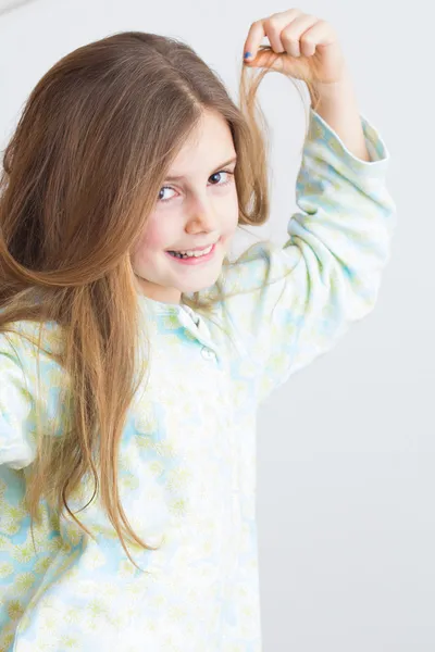 Cute little girl with long hair — Stock Photo, Image