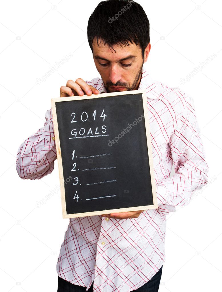 Bussinessman holding table with New Year 2014 goals