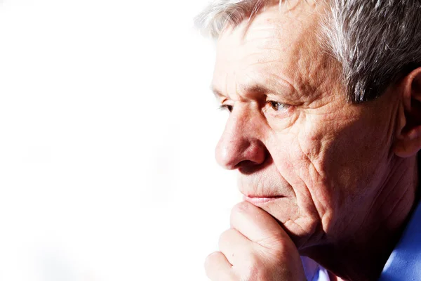 Close-up portrait of a senior man thinking — Stock Photo, Image