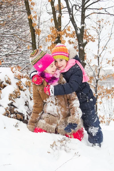 Two little girls having fun in winter — Stock Photo, Image