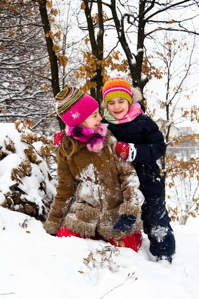 Two little girls having fun in winter — Stock Photo, Image