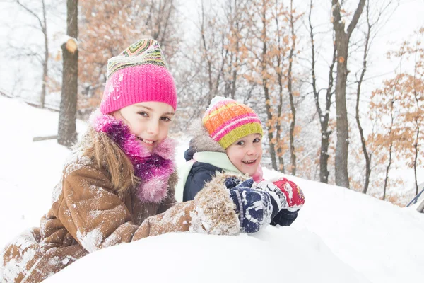 Two little girls having fun in winter — Stock Photo, Image