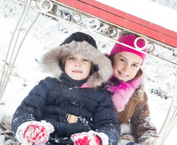 Two little girls having fun in winter — Stock Photo, Image