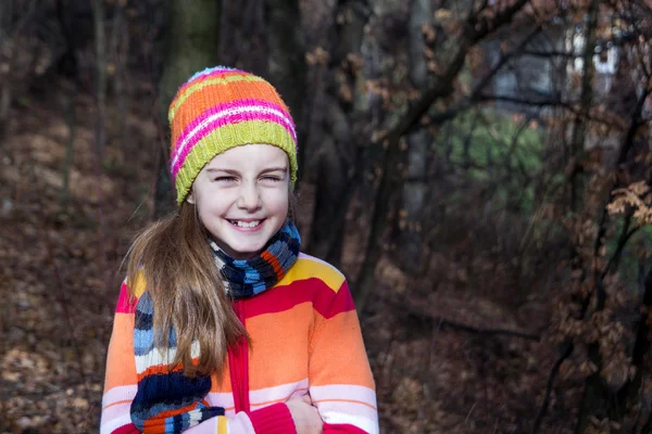 Little girl in hat spending time in the forest — Stock Photo, Image