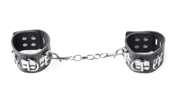 Black leather handcuffs isolated on white background — Stock Photo, Image