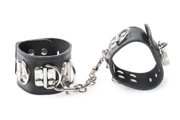Черные кожаные наручники на белом фоне — стоковое фото