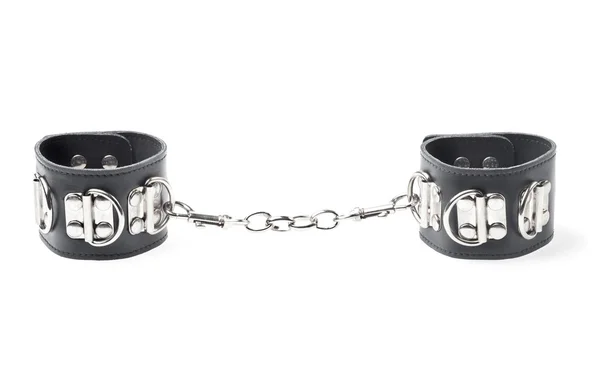 Чорні шкіряні наручники ізольовані на білому тлі — стокове фото