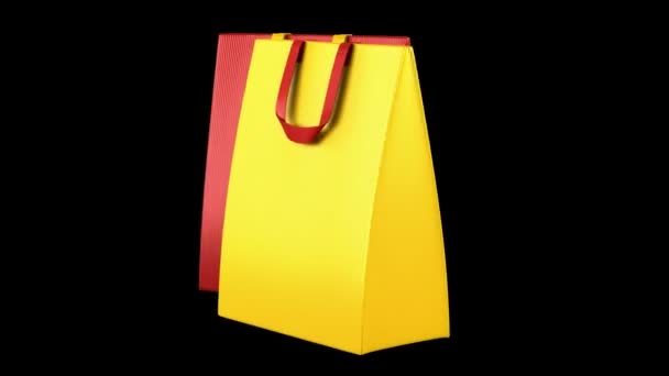 Two red and yellow shopping bags loop rotate on black background — Stock Video