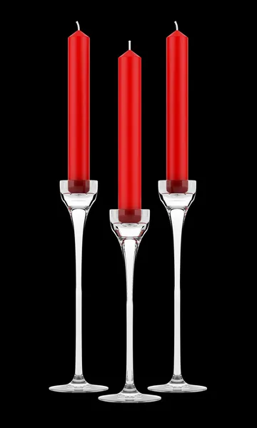 Drie glazen kandelaars met rode kaarsen geïsoleerd op zwarte rug — Stockfoto