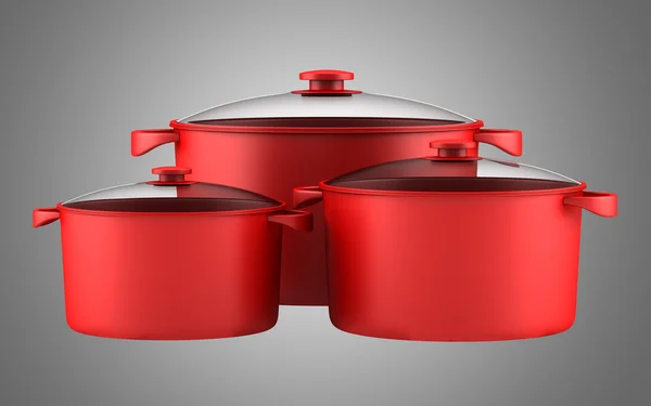 Trois casseroles rouges isolées sur fond gris — Photo