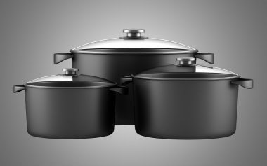 Üç pişirme tavaları izole gri arka plan üzerinde siyah