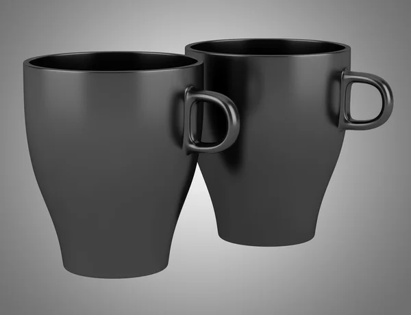 Two black ceramic cups isolated on gray background — Stock Photo, Image