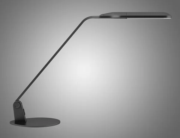 Lampy nowoczesne biurko czarne na białym tle na szarym tle — Zdjęcie stockowe