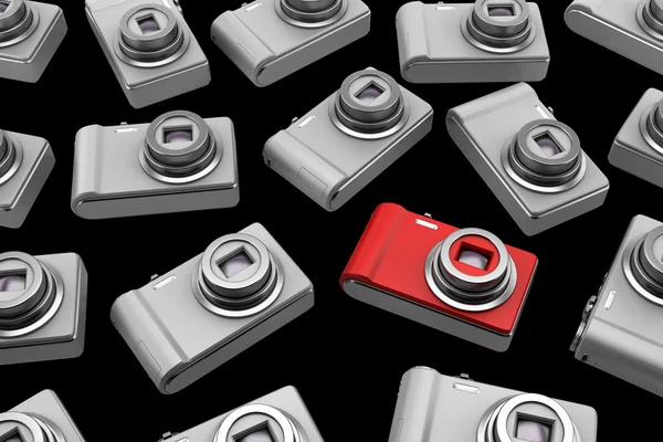 Röd punkt och skjuta fotokamera bland grå liknande isolerade på — Stockfoto