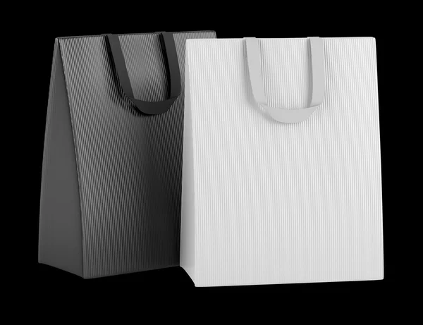 Dos bolsas de compras en blanco aisladas sobre fondo negro —  Fotos de Stock
