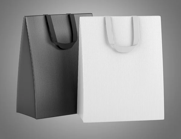Due borse della spesa vuote isolate su sfondo grigio — Foto Stock