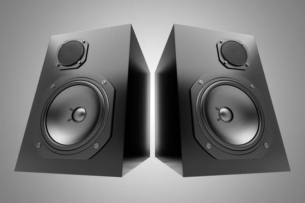 Deux haut-parleurs audio noirs isolés sur fond gris — Photo