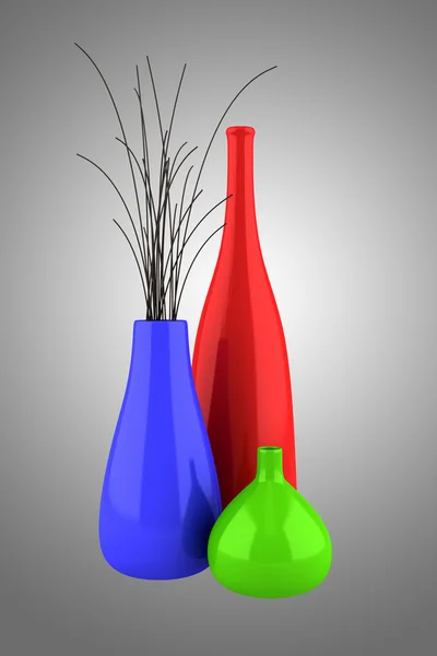 Trois vases de couleur avec du bois sec isolé sur fond gris — Photo