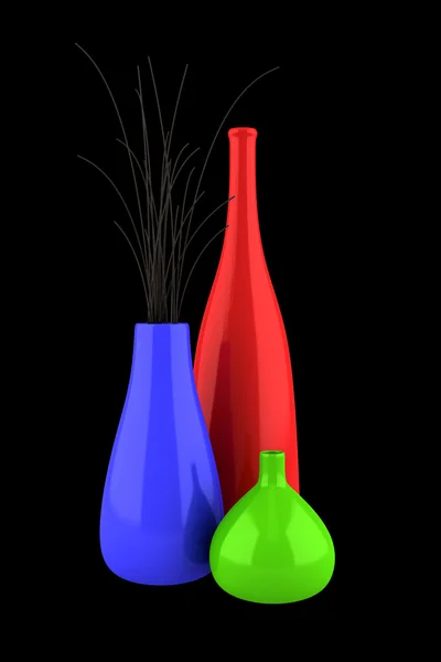 Três vasos coloridos com madeira seca isolada sobre fundo preto — Fotografia de Stock