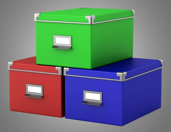 Três caixas de papelão de escritório de cores isoladas em fundo cinza — Fotografia de Stock