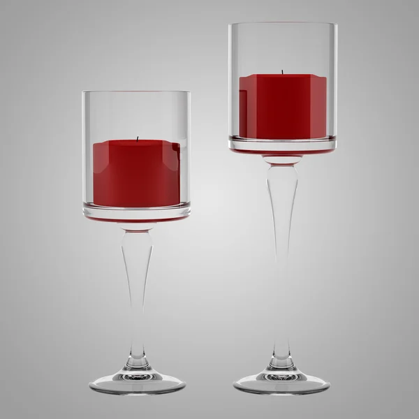Due candelabri di vetro con candele rosse isolate sul retro grigio — Foto Stock
