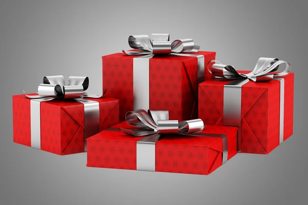 Red gift boxes with silver ribbons isolated on gray background — Stock Photo, Image