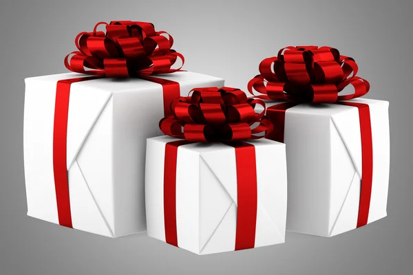 Gift boxes with red ribbons isolated on gray background — Stock Photo, Image