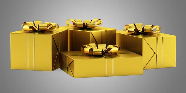 Žluté dárkové krabičky s zlatými stuhami izolovaných na šedé poza — Stock fotografie