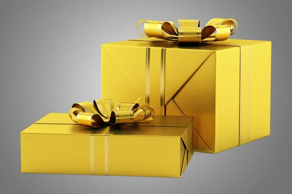 Желтые подарочные коробки с золотыми лентами, изолированные на серой спинке — стоковое фото
