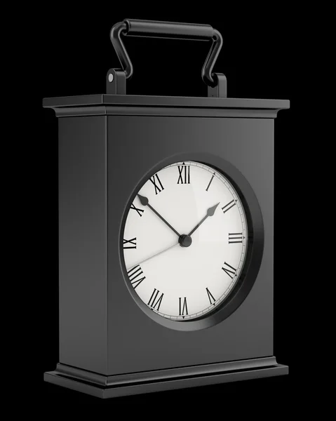 Black vintage table clock isolated on black background — Stock Photo, Image