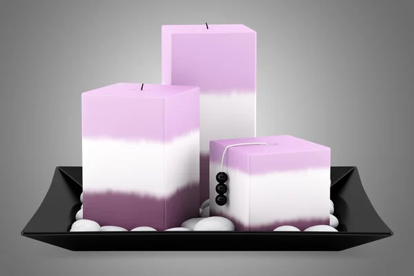 Three purple candles on dish isolated on gray background — Stock Photo, Image