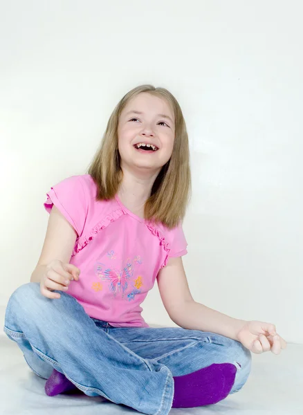 The girl sits on a floor — Stock Photo, Image