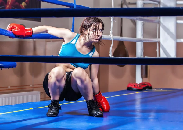 Girl boxer in boxing ring — Stock Photo, Image