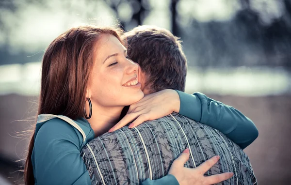 Love and affection between a young couple at the park — Stock Photo, Image