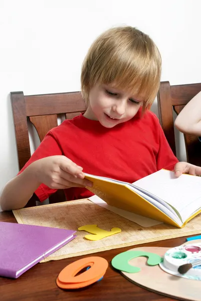 The boy of school return which note book — Stock Photo, Image