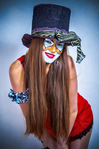 Retrato de una chica payaso con la cara pintada . —  Fotos de Stock