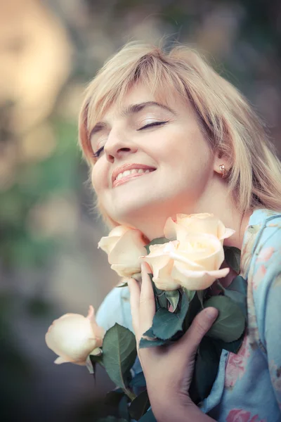 Happy smiling woman with flower Royalty Free Stock Photos