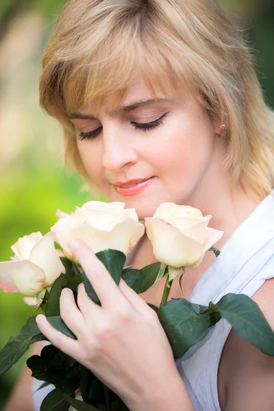 Happy smiling woman with flower Royalty Free Stock Images