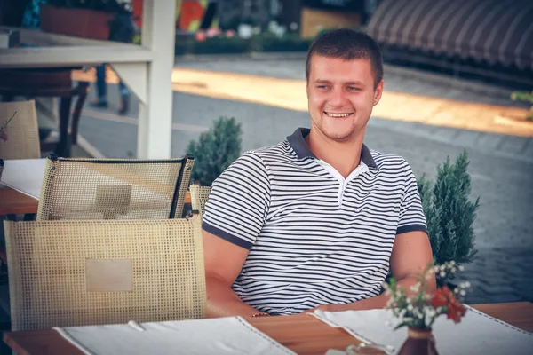 Man sitting in cafe — Stock Photo, Image