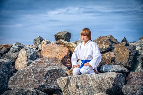 Boy practising yoga — Stock Photo, Image