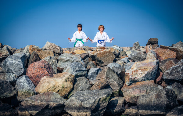 Boy and girl practising yoga