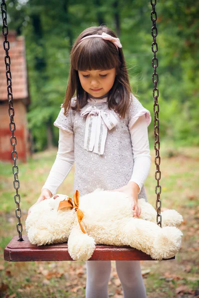 Girl and amusing bear — Stock Photo, Image