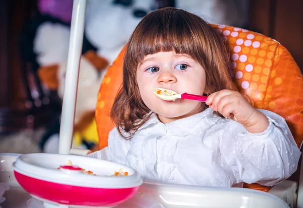 Eating baby girl — Stock Photo, Image