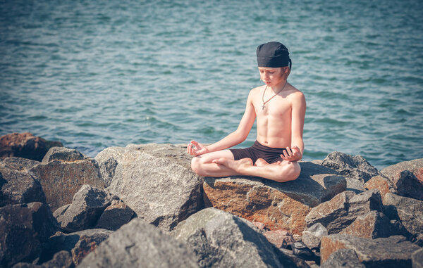 Boy practising yoga