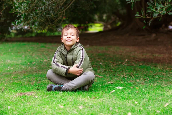 Hispanic Boy Sitting Grass Park — Stock Photo, Image