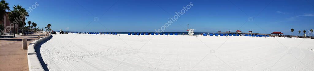 Clearwater Beach beach on the Gulf of Mexico in Florida. White sand. and groups of tourists.