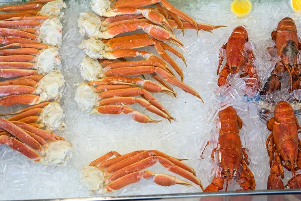 Fresh crab legs on the seafood market counter. view from above.
