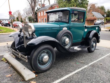 Leesburg. Virginia. USA. December 9, 2021. A 1930s Ford pickup, Model A, in a city parking lot.
