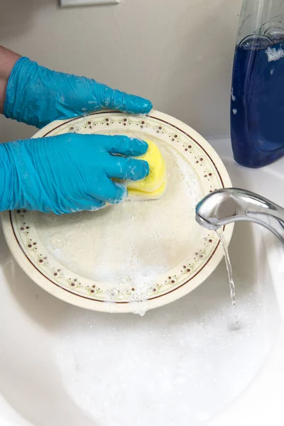 Hands Gloves Wash Plate Running Water Close – stockfoto